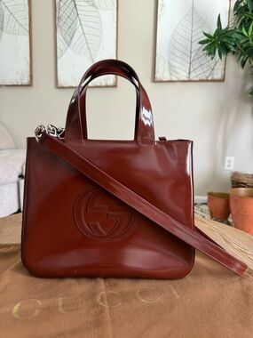 Authentic Gucci Glossy Brown Patent Leather Satchel with Double G Emboss